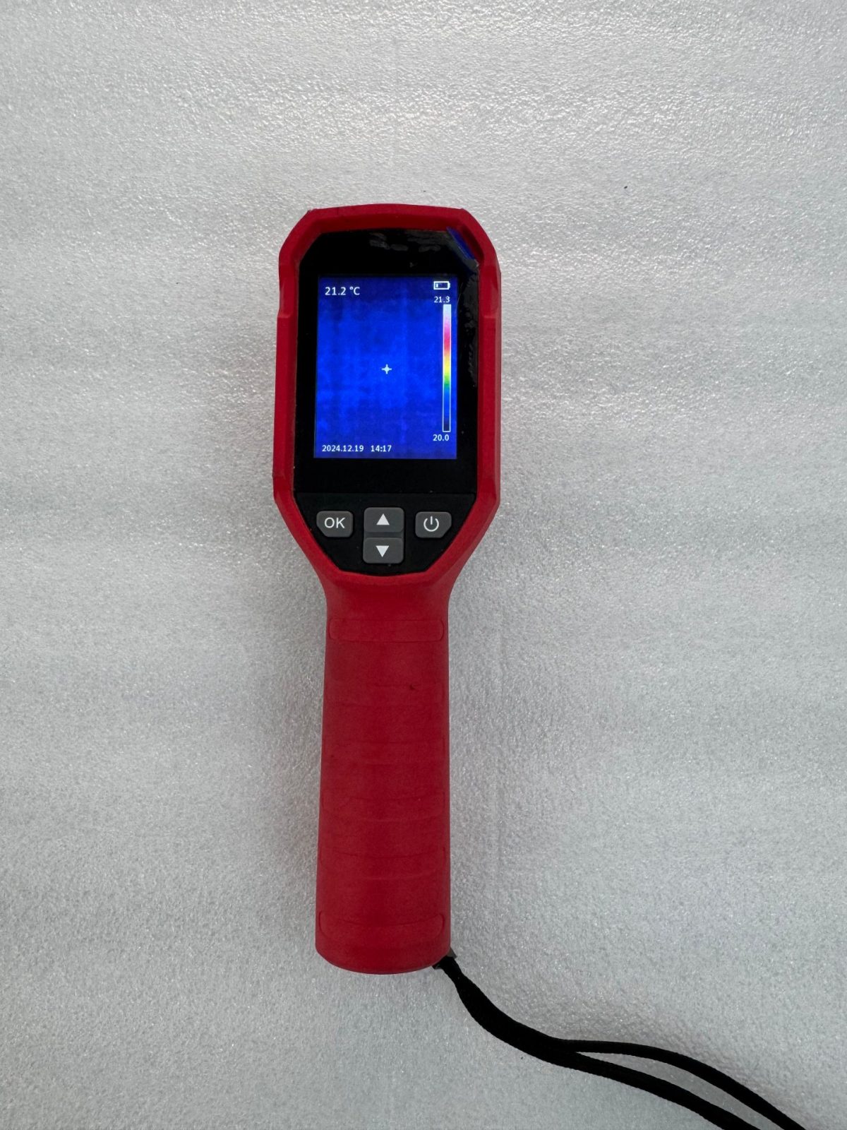NovaBESS quality control: handheld thermal imager used for battery cell surface temperature inspection